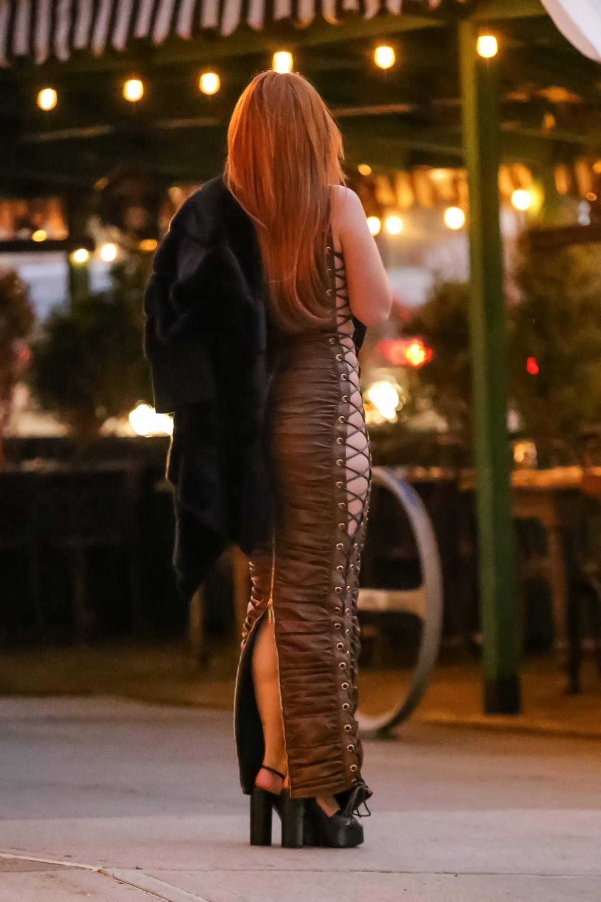 bella thorne shows off her curves in a figure-hugging brown dress