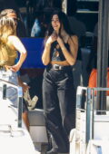 Dua Lipa is all smiles while enjoying a boat day with friends in Sydney, Australia