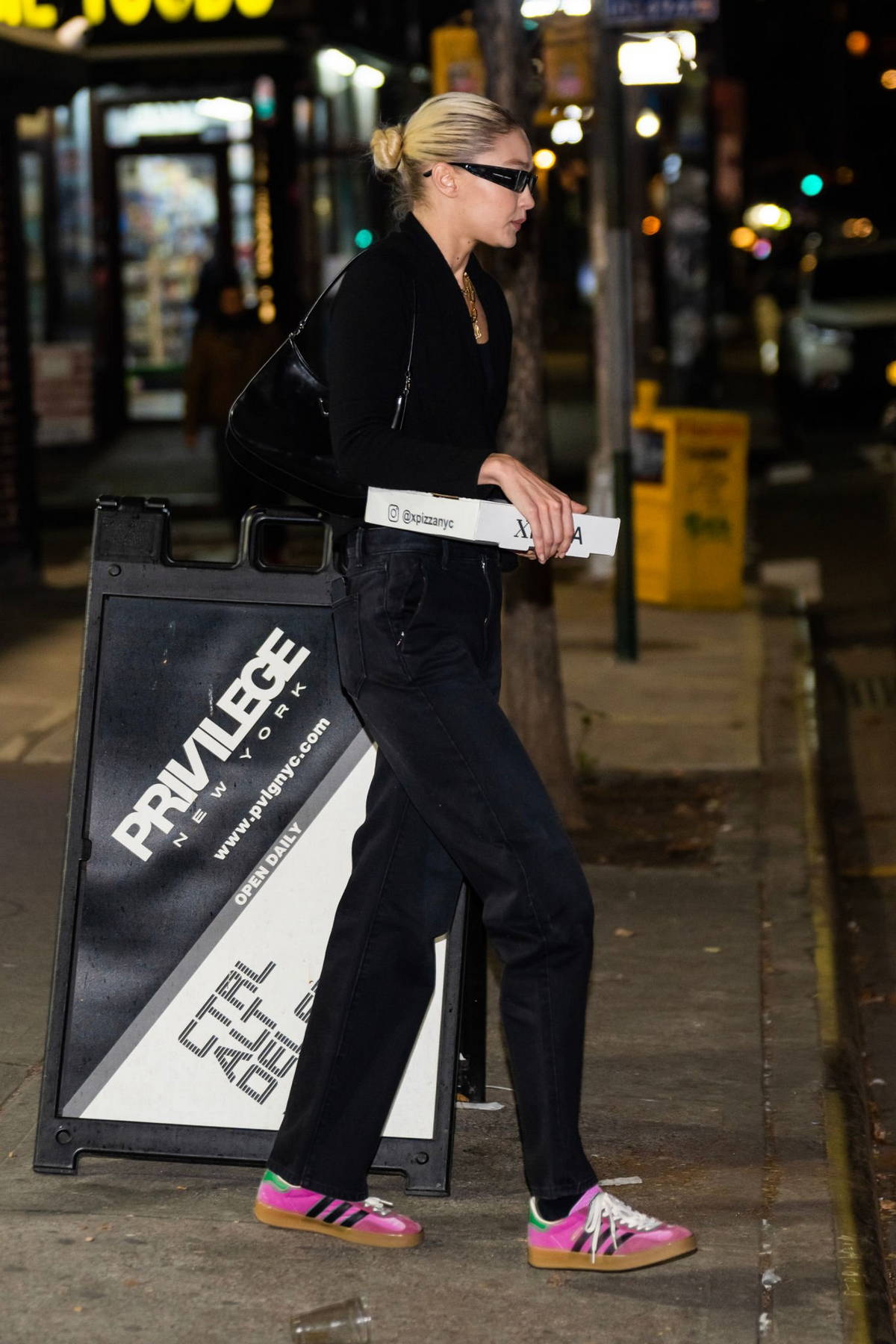 Hailey Bieber displays her toned figure in crop top and leggings