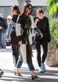 Kendall Jenner stuns in a black and white leather trench coat during a fitting at the Proper Hotel in Los Angeles