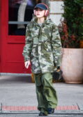 Kiernan Shipka dons a camo jacket with green pants while out in New York City