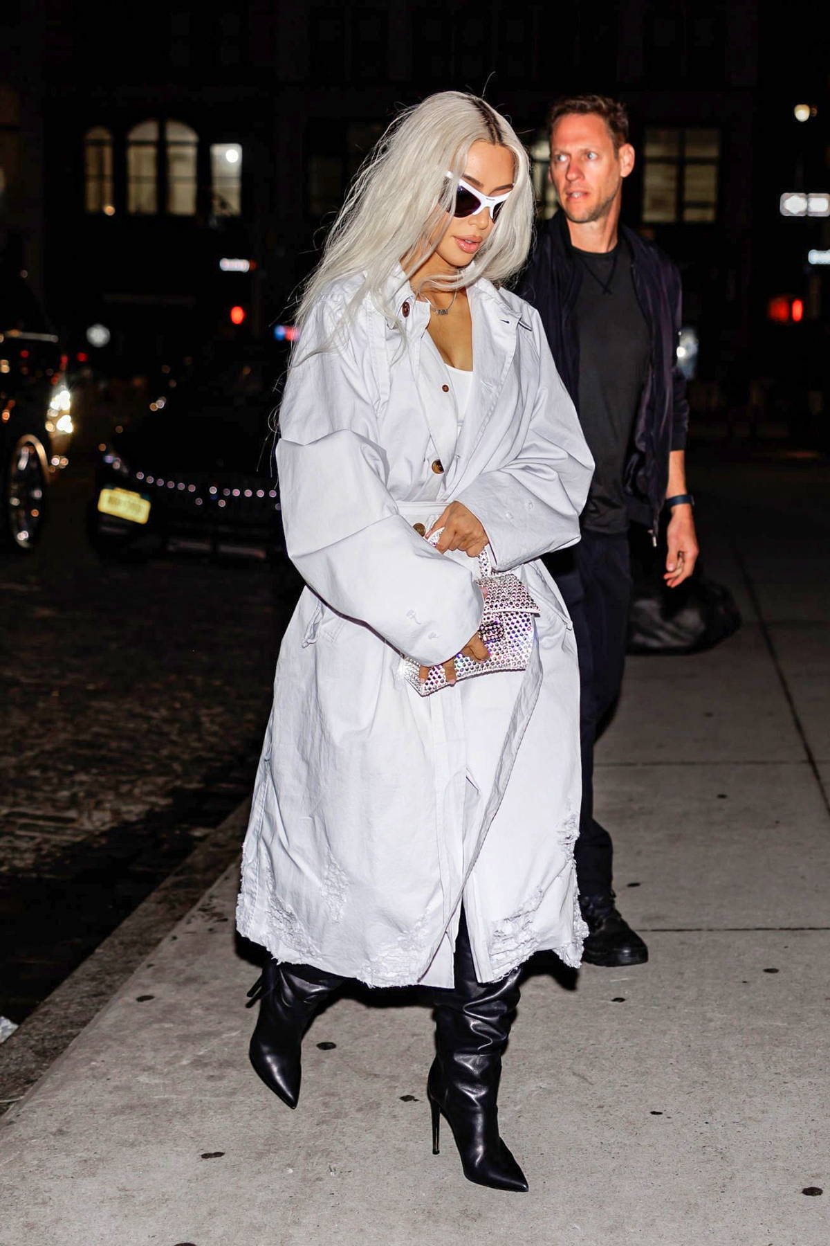 kim kardashian looks striking in a white trench coat with thigh-high ...