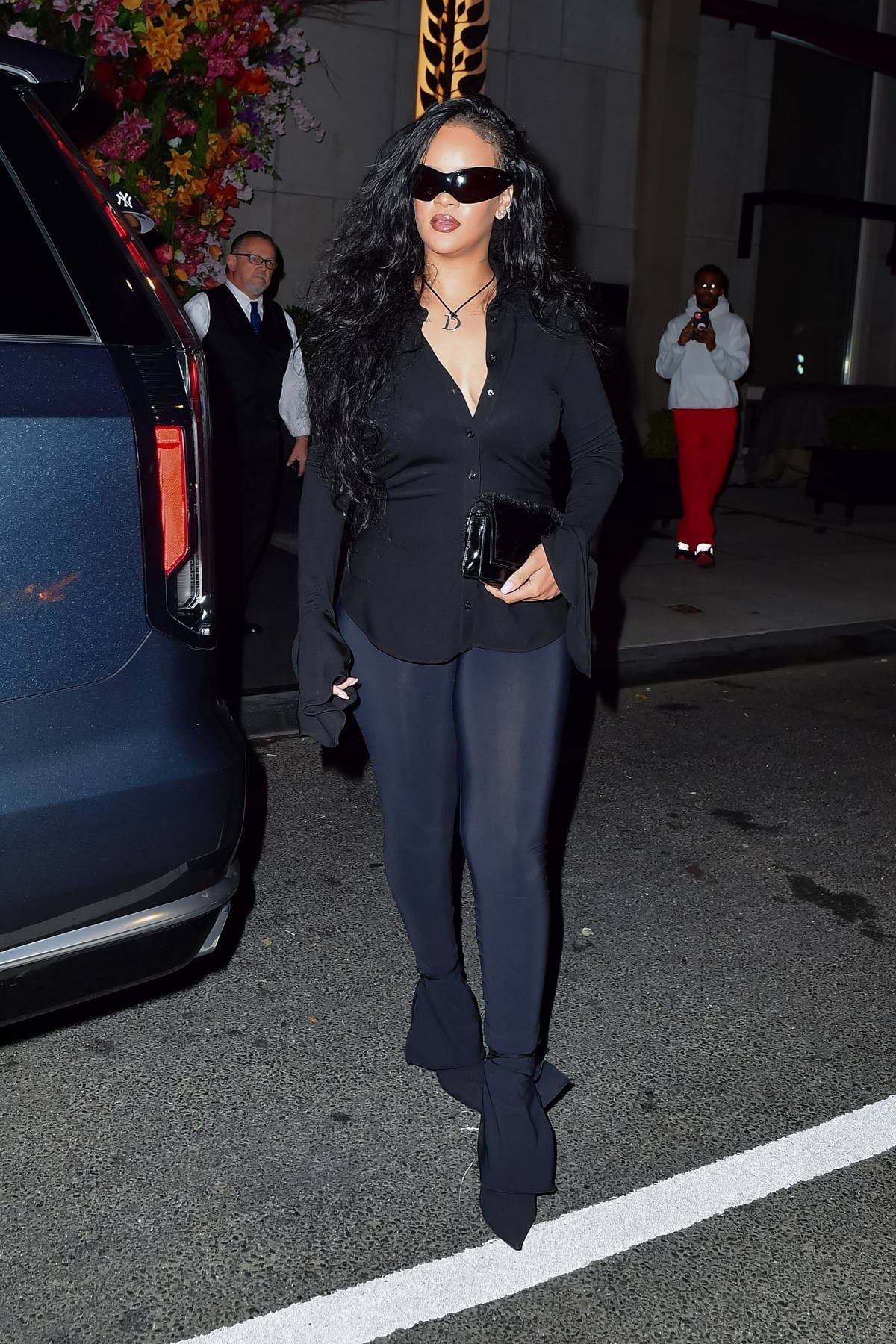 rihanna looks stunning a black shirt with matching leggings and heels while  stepping out for dinner in new york city-051122_7