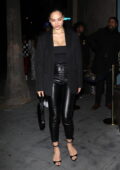 Model Shanina Shaik wears a Gucci belt with classic beige slacks out in  West Hollywood Featuring