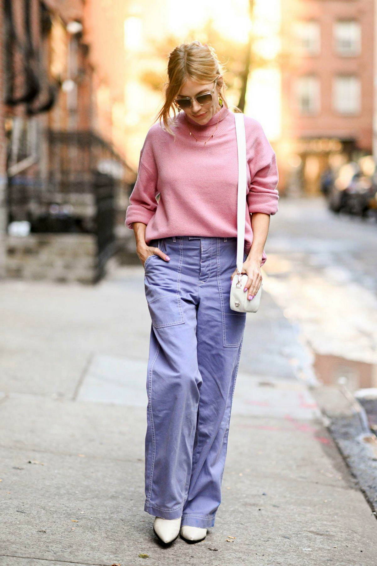 sienna miller looks pleasant in a pink sweater and lavender pants while out  running errands in new york city-011122_5
