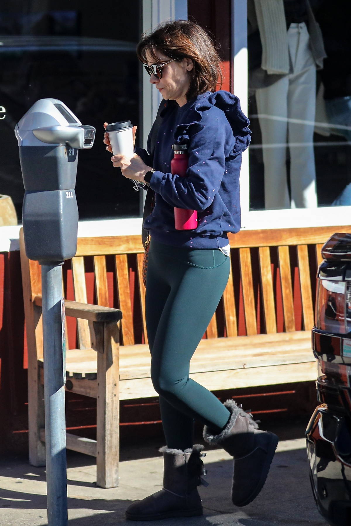 Zooey Deschanel stays cozy in a blue sweater, leggings and UGGs