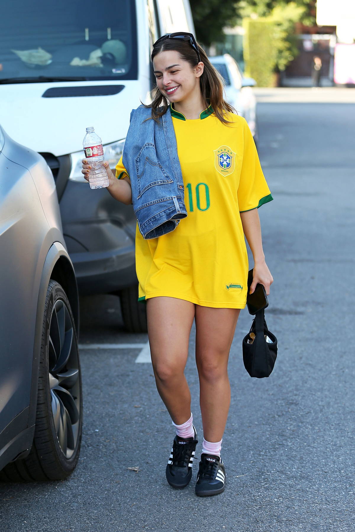 addison rae rocks a brazil football jersey and carries her jeans