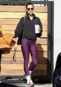 Alessandra Ambrosio shows off her toned legs in purple leggings