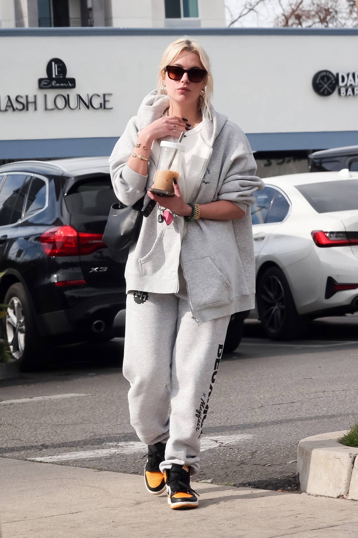 Ashley Benson keeps it casual and cozy in grey sweats during a trip to ...