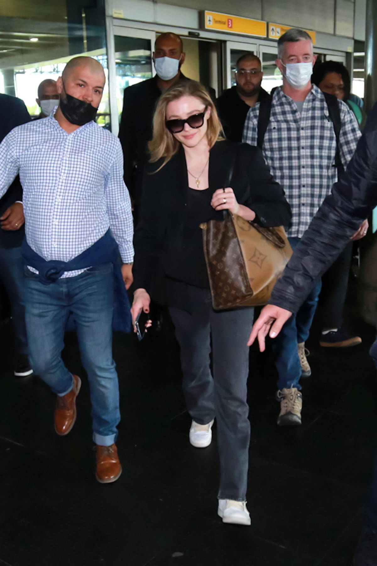 Chloe Grace Moretz spotted with her Louis Vuitton luggage as she