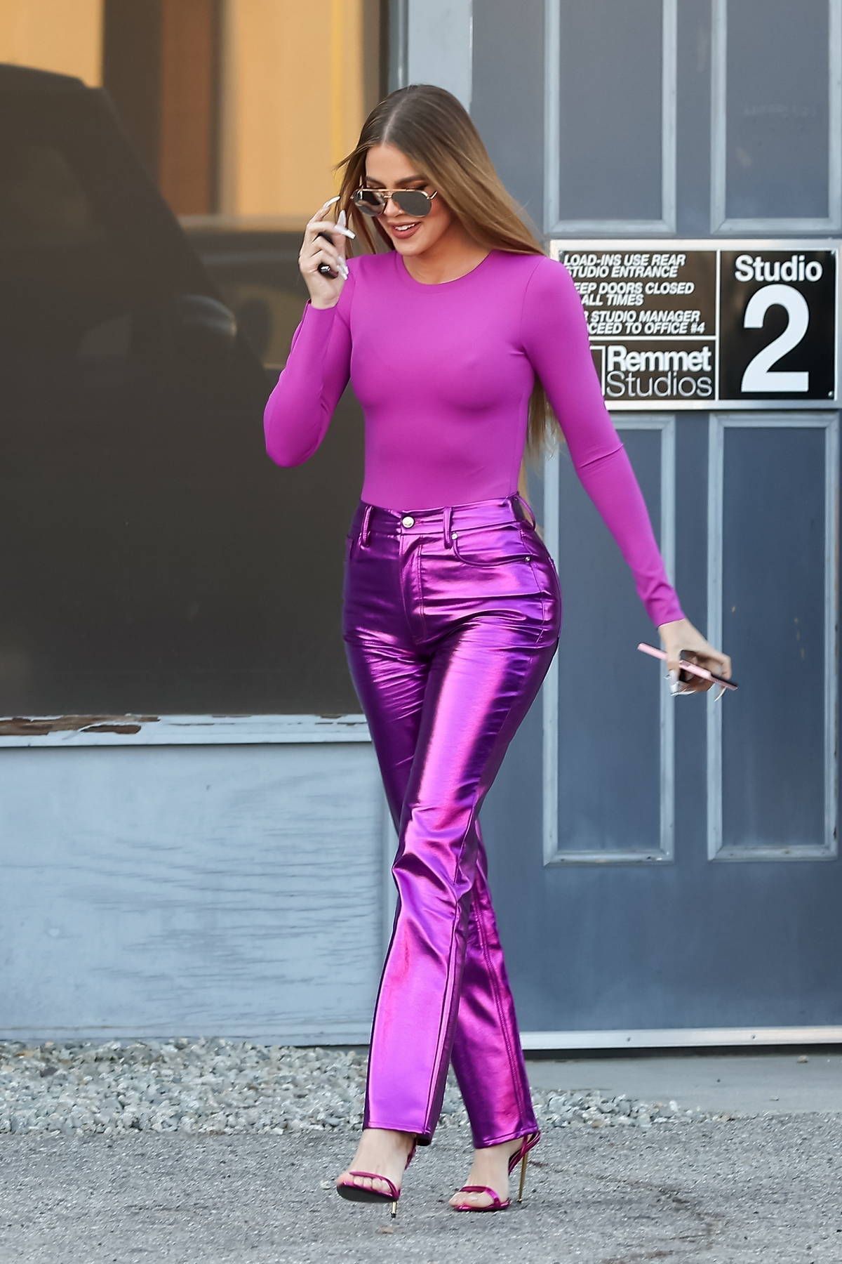 Khloe Kardashian looks striking in skintight purple top with matching pants  as she leaves a photoshoot