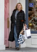 Kirsten Dunst wears a dark overcoat while out for some Christmas shopping in Studio City, California