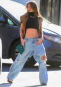 Leni Klum displays her taut tummy in a black crop top during a photoshoot on the streets of New York City