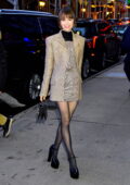 Lily Collins looks fashionable in a grey mini dress with matching blazer  and sheer black tights