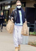 Lily-Rose Depp wears a leather jacket with comfy sweats while shopping for groceries at Erewhon in Studio City, California