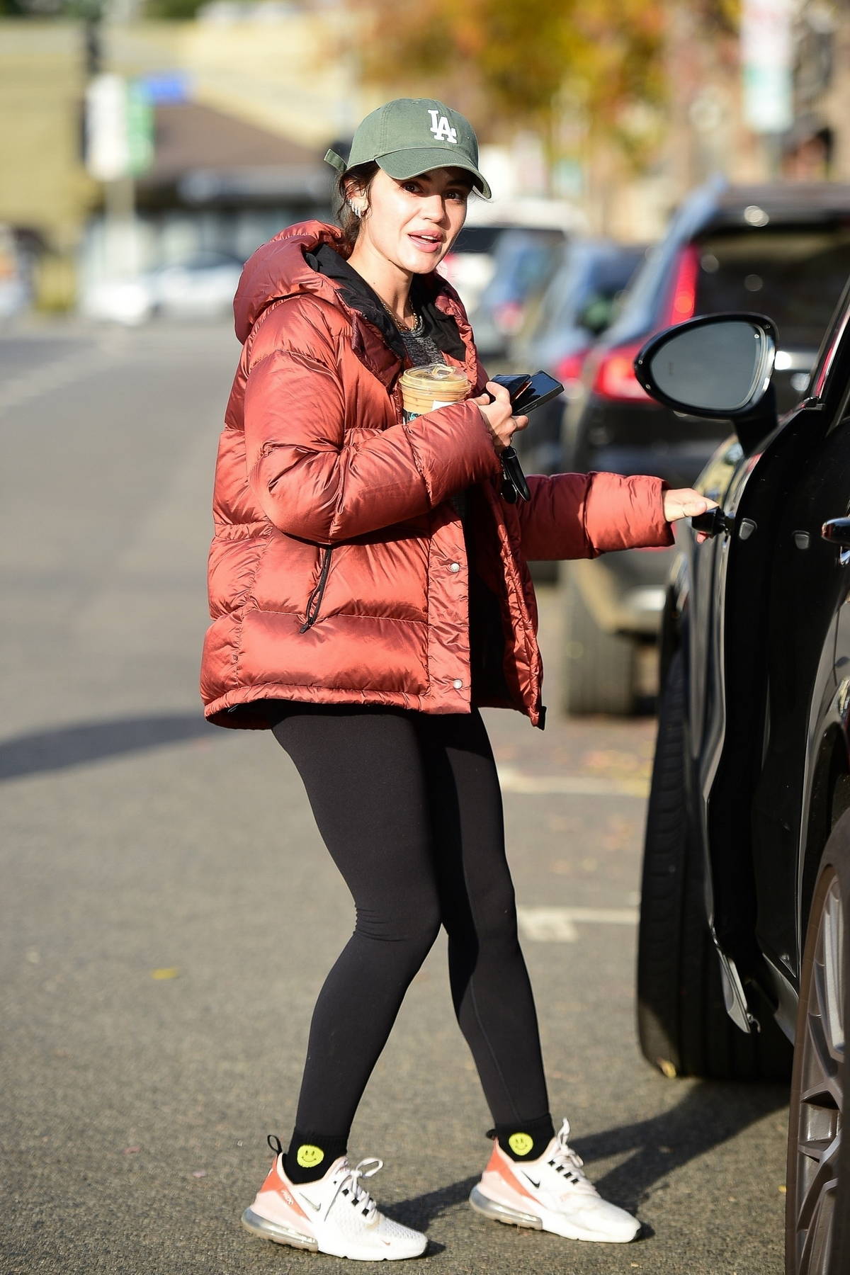 lucy hale sports a copper colored puffer jacket and black leggings during an early morning coffee run in los angeles 171222 8