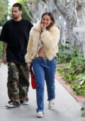 Addison Rae shows off her midriff in a white lacy camisole while out shopping on Melrose Place in Los Angeles