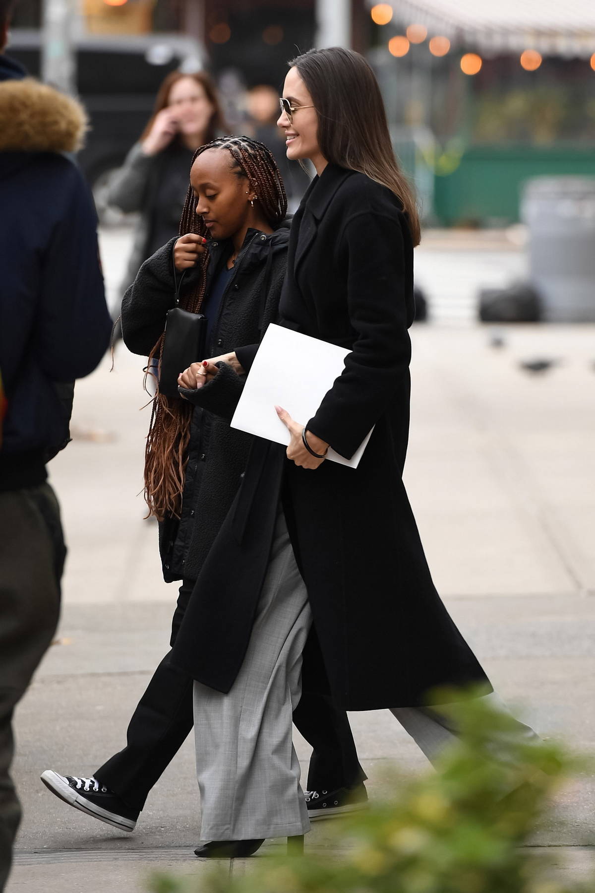 Angelina Jolie looks chic in a white sweater and black skirt while stepping  out with her daughter Zahara in New York City-160523_1
