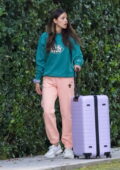 Eiza Gonzalez keeps it casual in cozy sweats while out with a large suitcase in Los Angeles