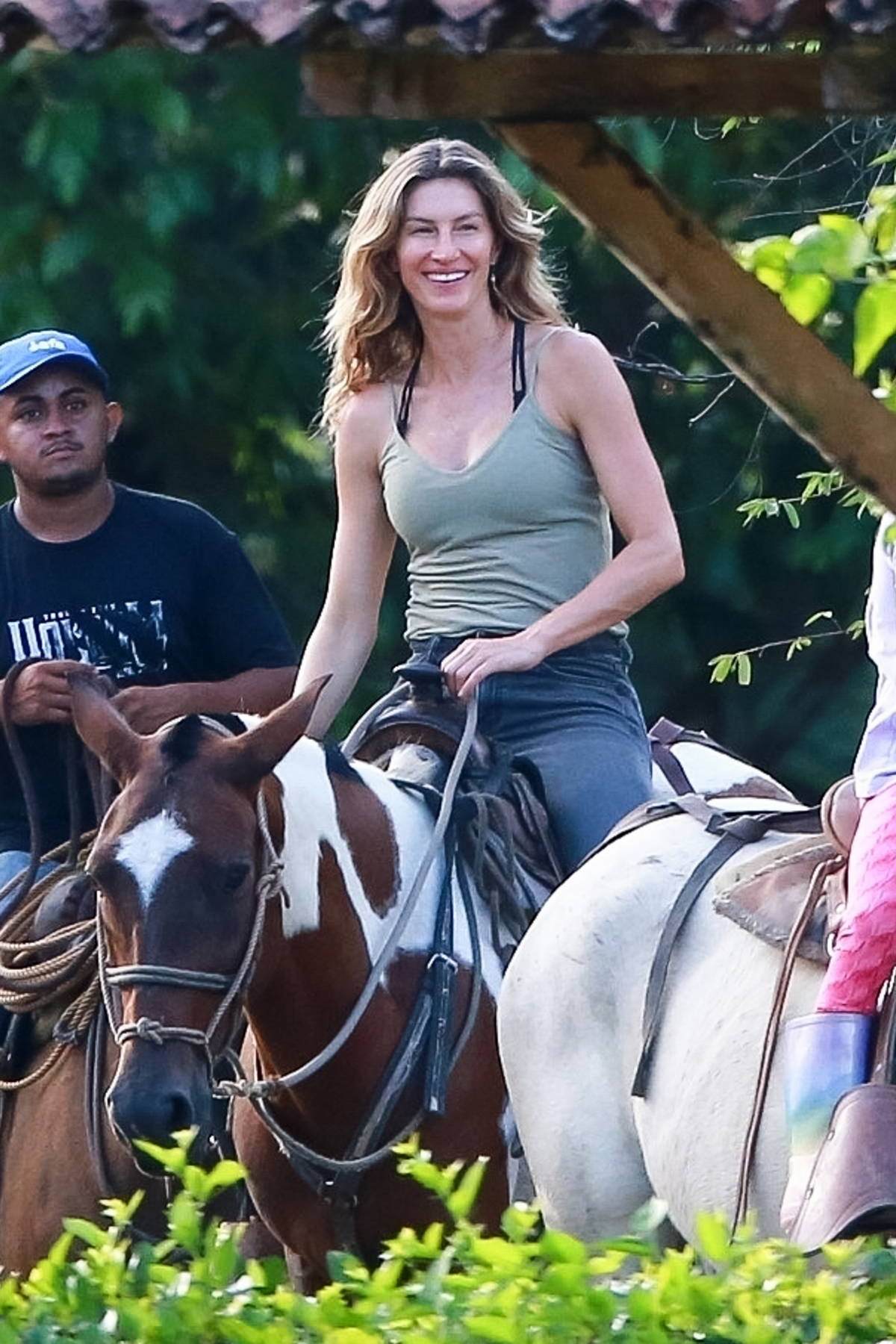 Gisele Bundchen is all smiles as she goes horseback riding with jiu-jitsu  instructor Joaquim Valente