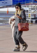 Heidi Klum bundles up in trendy quilted sweats as she arrives at the airport for a flight out of Aspen, Colorado