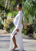 Jasmine Tookes looks radiant in a form-fitting white dress during her baby shower in Los Angeles
