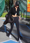 Kendall Jenner dons a leather jacket and flared leggings for a hot