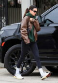 Kendall Jenner rocks a black sports bra and leggings with a leather jacket  as she leaves