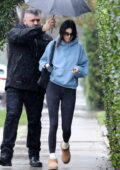 Kendall Jenner sports a hoodie and leggings as she braves the rain while running a few errands in Beverly Hills, California