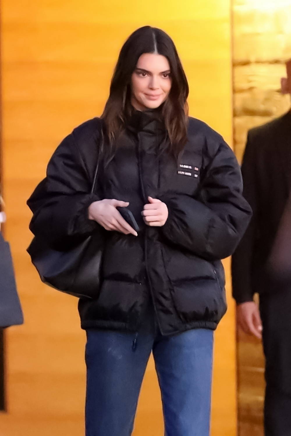 kendall jenner wears a puffy jacket and blue jeans for dinner with ...