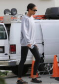 Laura Harrier wears a sweatshirt and leggings as she leaves a workout in West Hollywood, California