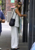 Margot Robbie looks chic in an oversized white vest with matching trousers while stepping out in Sydney, Australia