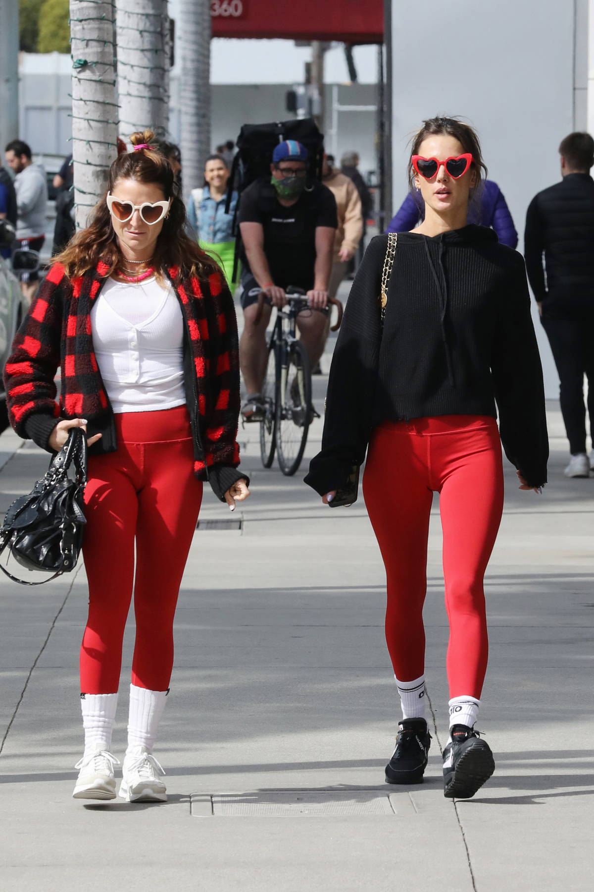Alessandra Ambrosio rocks red leggings with matching heart shape sunglasses  while out on Valentine's Day in