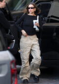 Hailey Bieber looks cool in a black top and beige cargo pants while stepping out for lunch with Justine Skye in West Hollywood, California