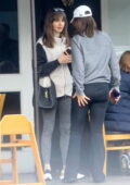 Lily Collins wears a fleece and leggings during a lunch outing with friends in Beverly Hills, California