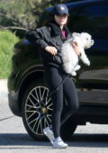 Lucy Hale wears a black jacket and leggings while she takes her pups to a dog park in Hollywood Hills, California