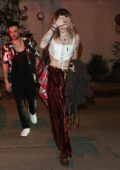 Paris Jackson looks fab in a white cropped corset top and shiny red pants while attending a Pre-Grammy Party in Los Angeles