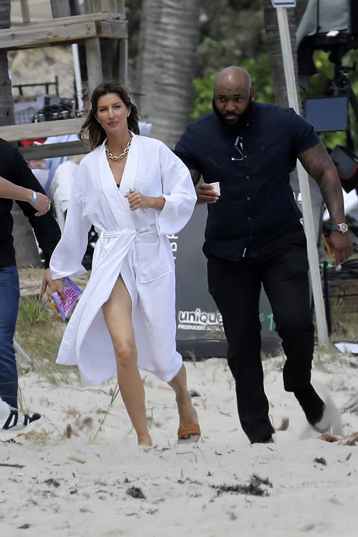 gisele bundchen looks incredible in a louis vuitton swimsuit during a beach  photoshoot in miami, florida-230323_5