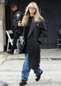 Heidi Klum keeps it trendy in an overcoat and cargo denim while heading to a beauty spa in Los Angeles