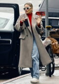 Hilary Duff dons a grey long coat with a red turtleneck while making a Starbucks run in Studio City, California