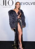 Jennifer Lopez shows some legs in a high-slit gown while attending her J-Lo x Revolve launch party in Los Angeles