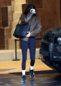 Kendall Jenner rocks a leather jacket with a casual tee and leggings while running errands in Beverly Hills, California
