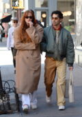 Sophie Turner bundles up in a camel coat while stepping for a stroll with hubby Joe Jonas and a few friends in New York City