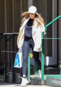 Abby Champion sports a white hoodie and black leggings during a power walk  in Brentwood, California