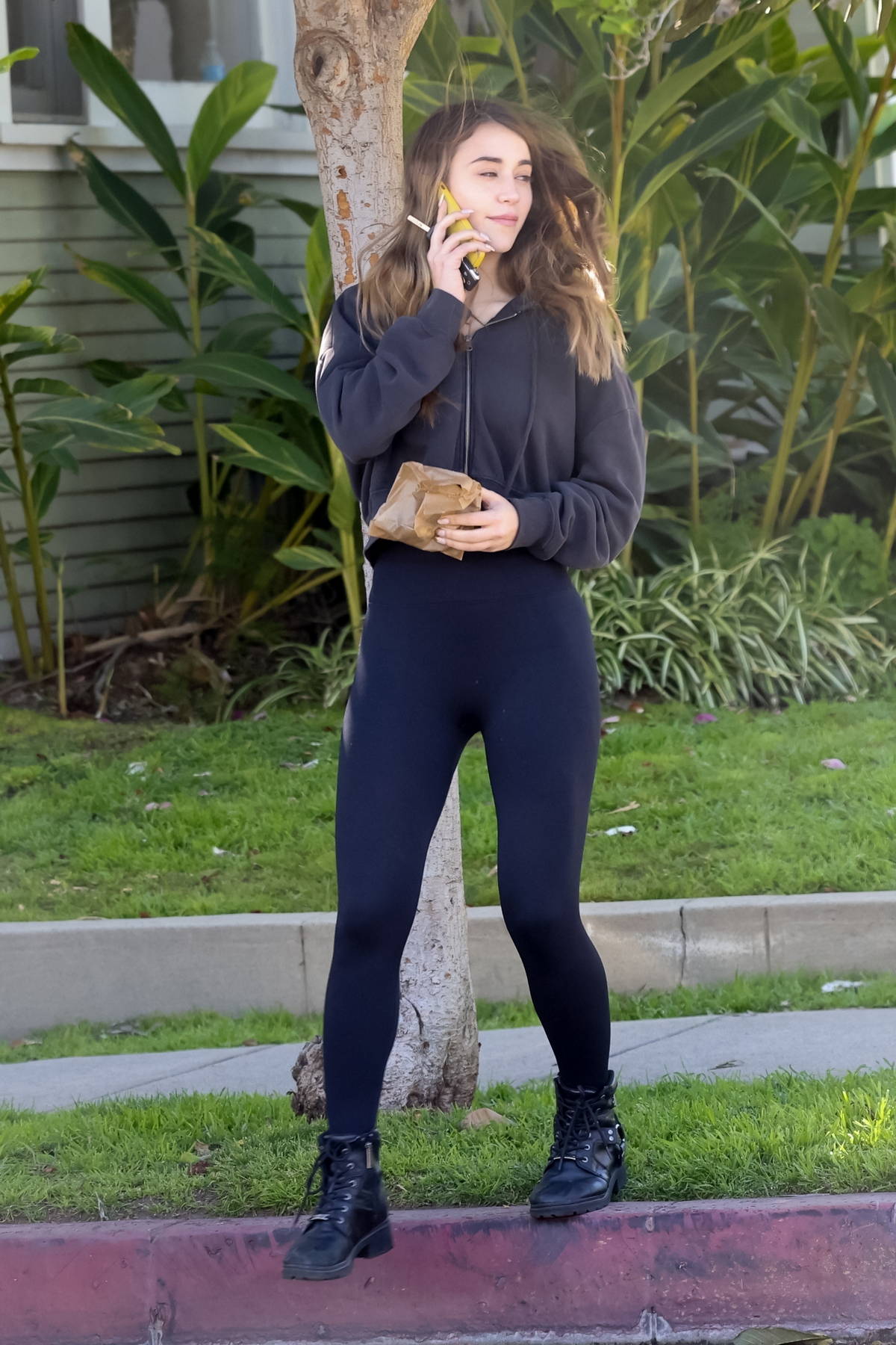 Caylee Cowan dons a cropped hoodie and leggings during a lunch