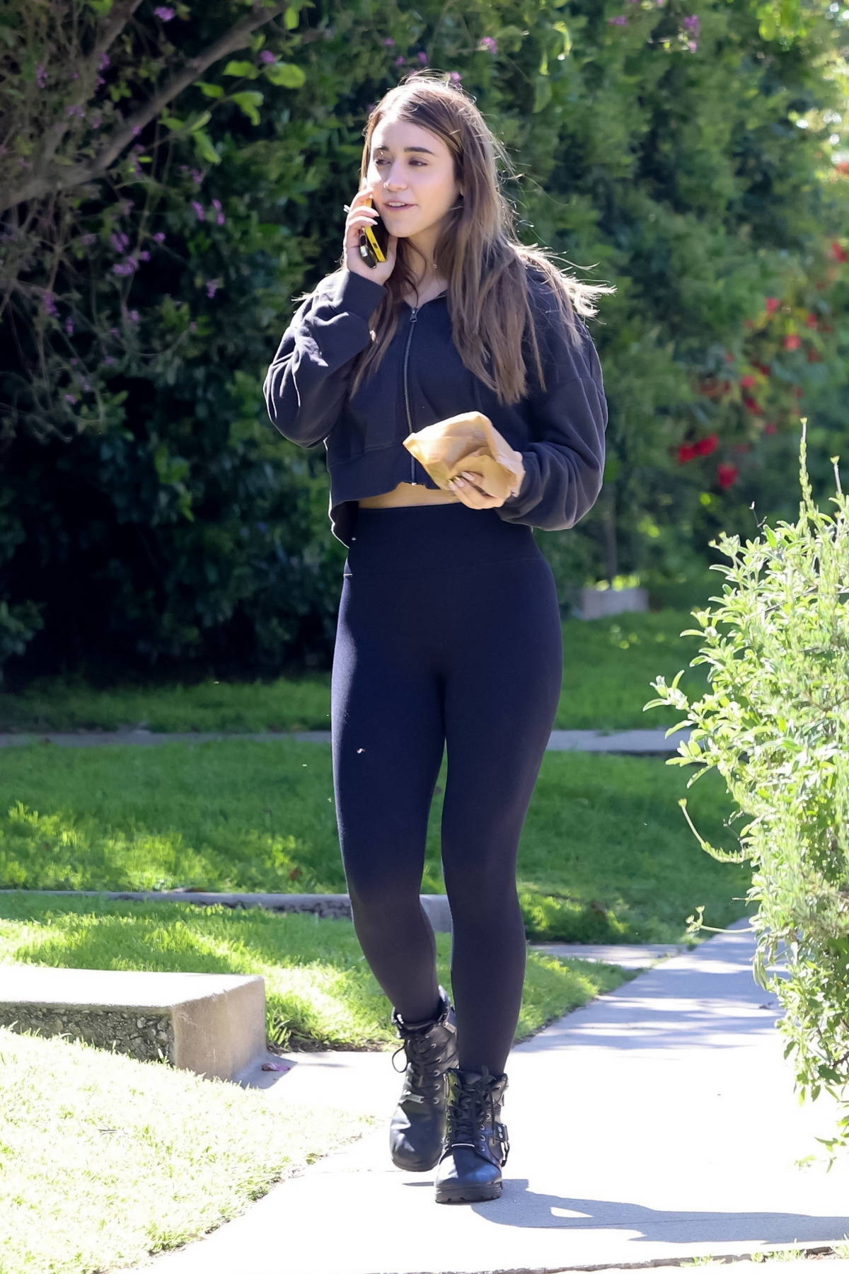 Caylee Cowan dons a cropped hoodie and leggings during a lunch