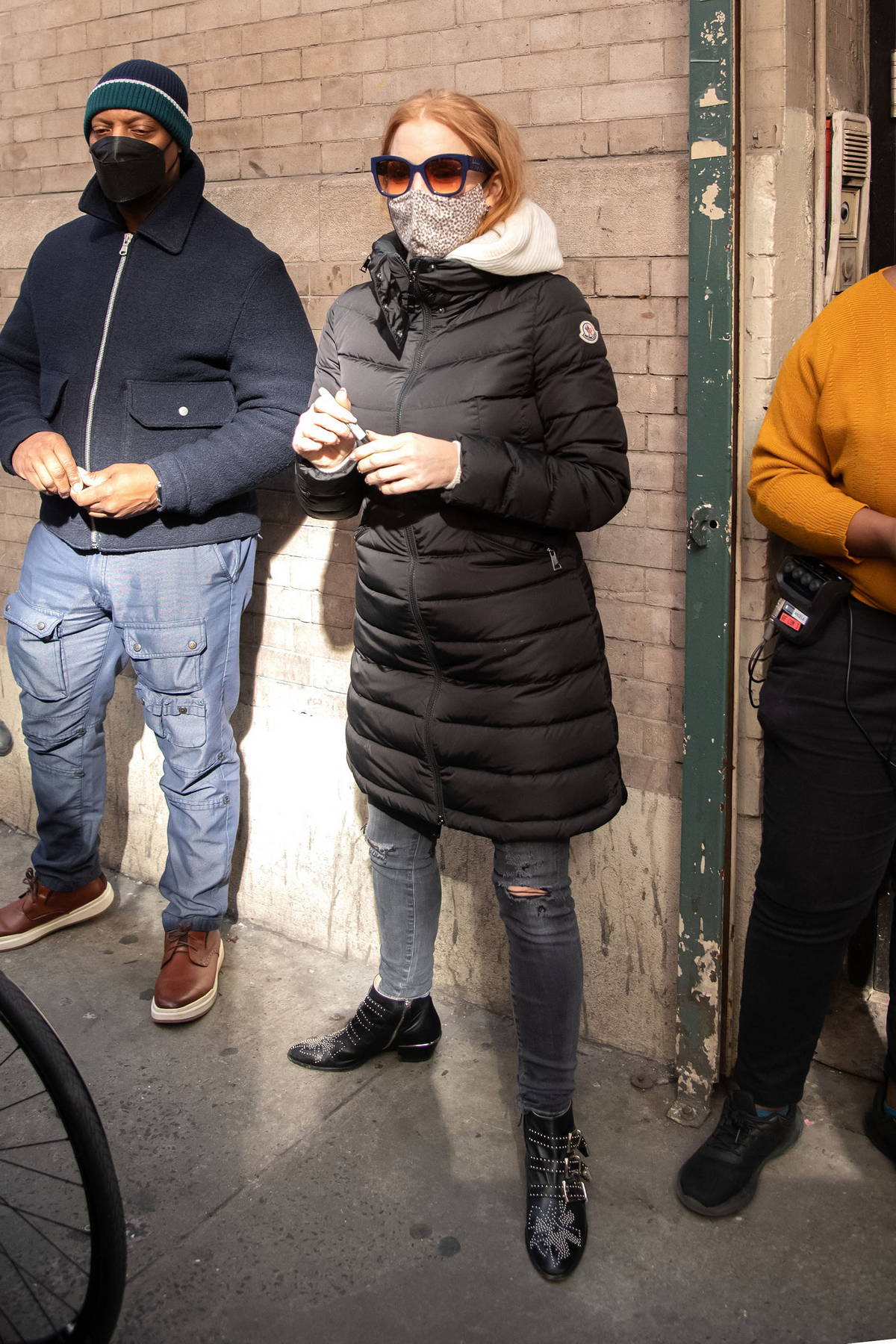 A Woman Wearing A Puffy Down Jacket Shaped Like by Victoria Roberts