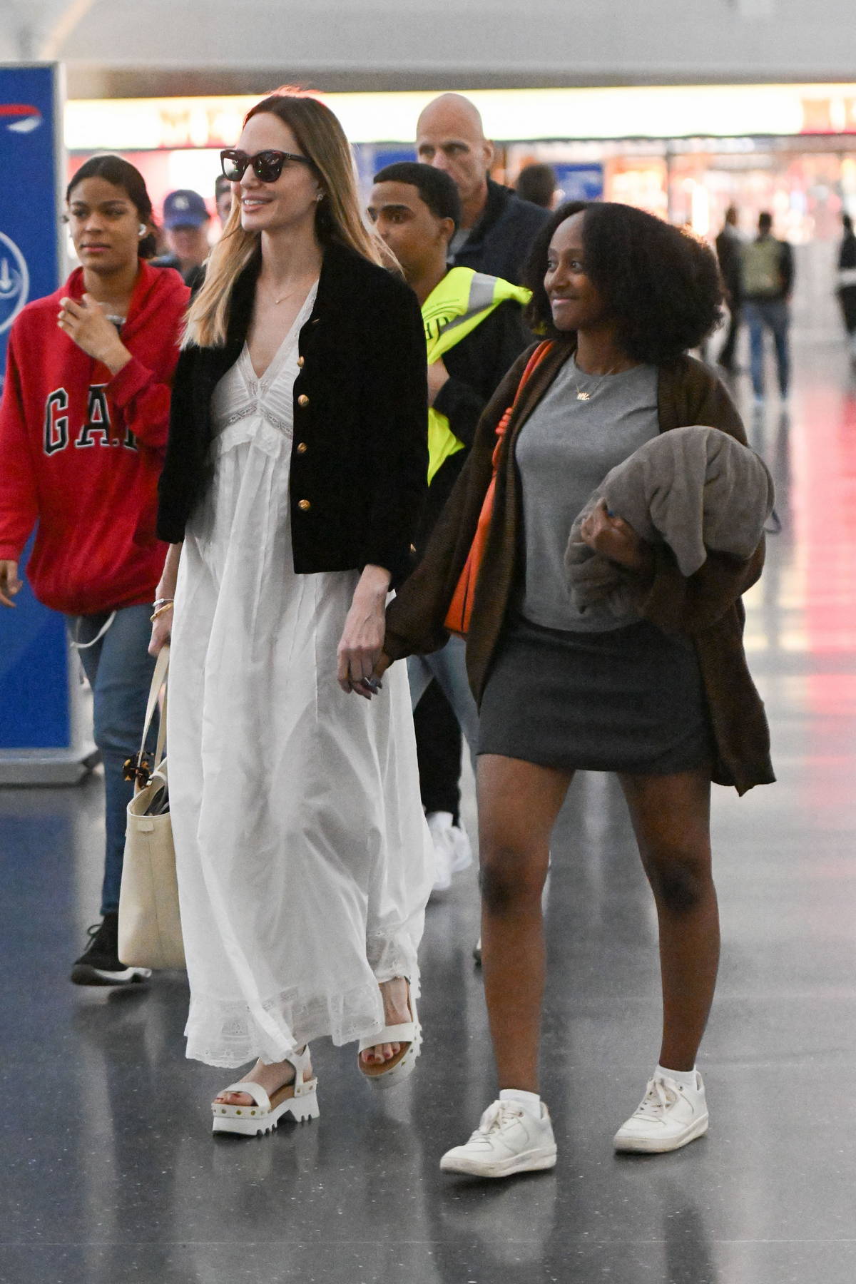Angelina Jolie Stuns in a Flowing White Dress to Shop with Zahara
