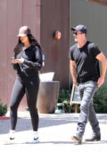 April Love Geary shows off her long legs in black leggings while out  shopping with Robin