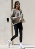 Kaia Gerber dons a beige sweater and black leggings for a yoga class in West Hollywood, California
